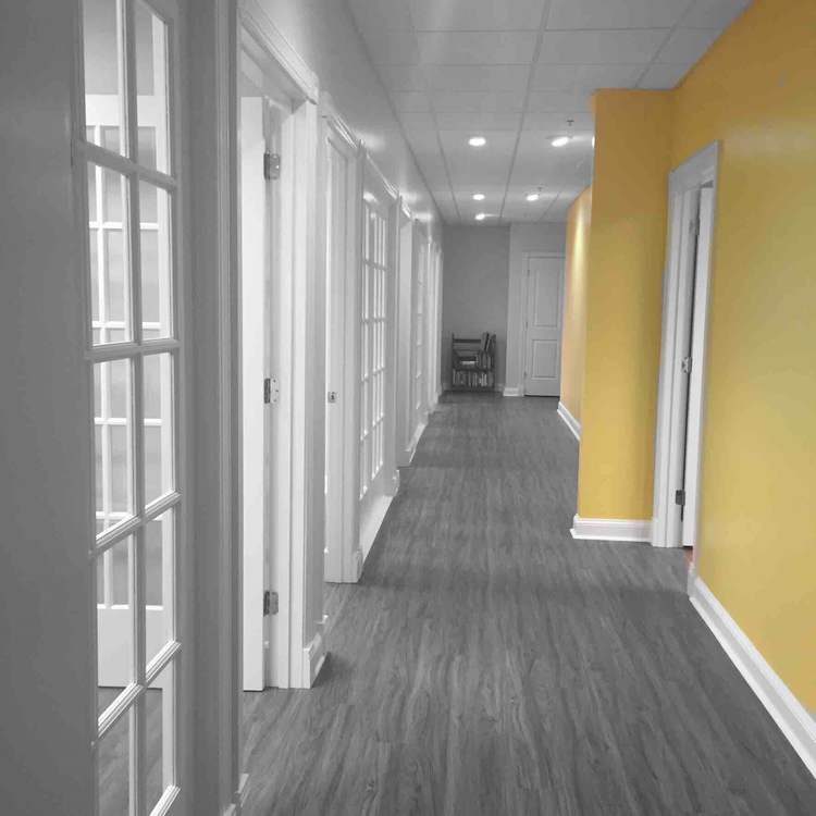 The hallway of therapy rooms at TALK's Miami Circle office