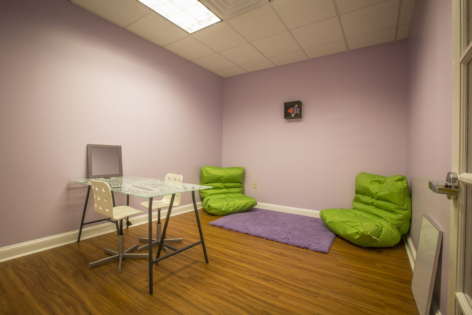 A therapy room at TALK with a low table and bean bags